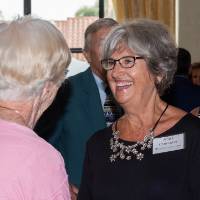 Anita Christopher talking with a guest.